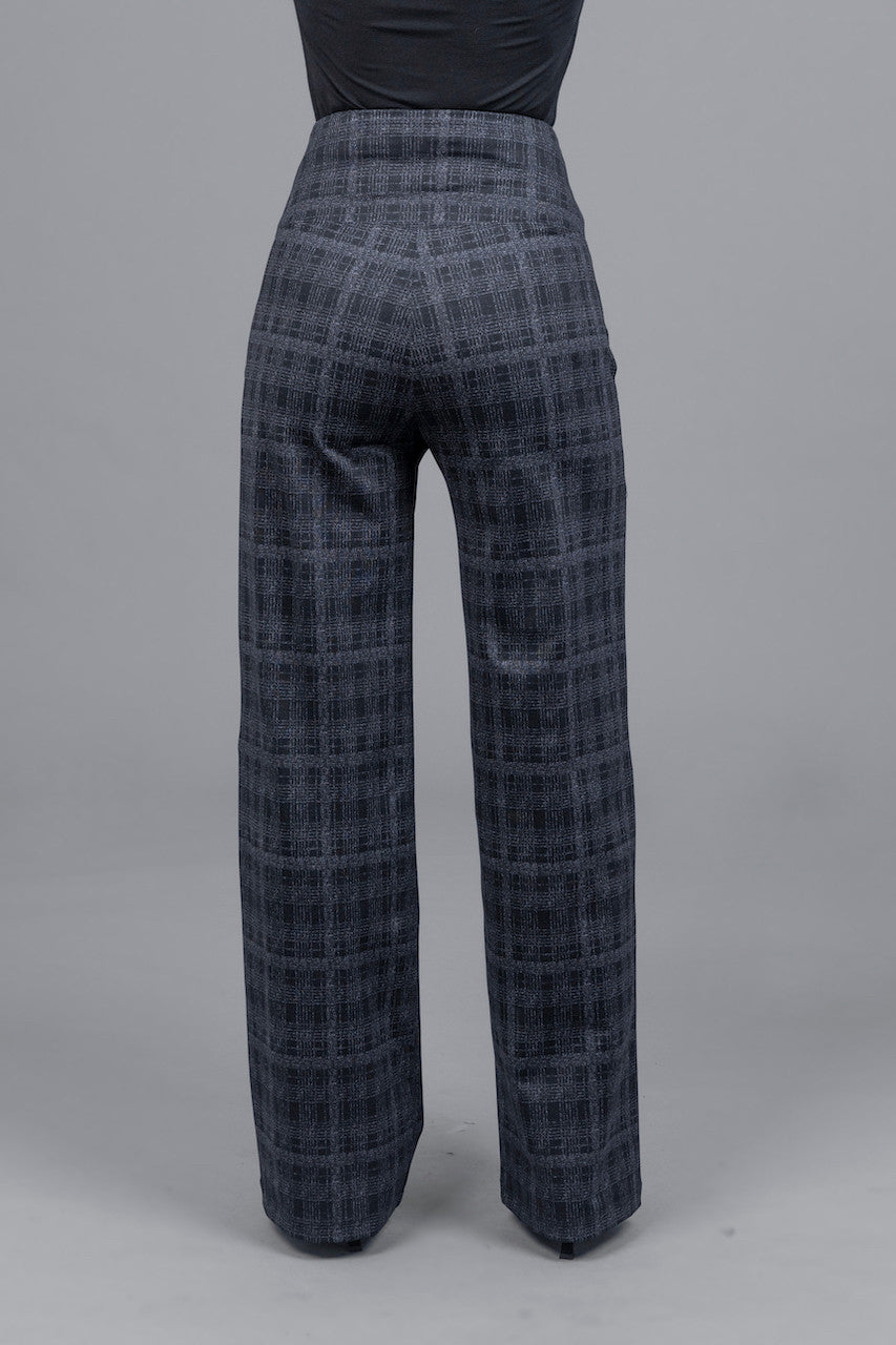 Plaid patterned pants on a gray background