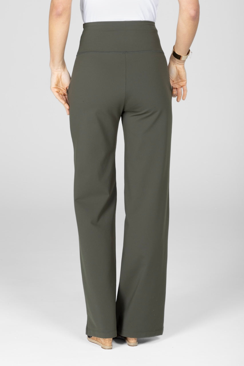 Person wearing olive green pants on a white background