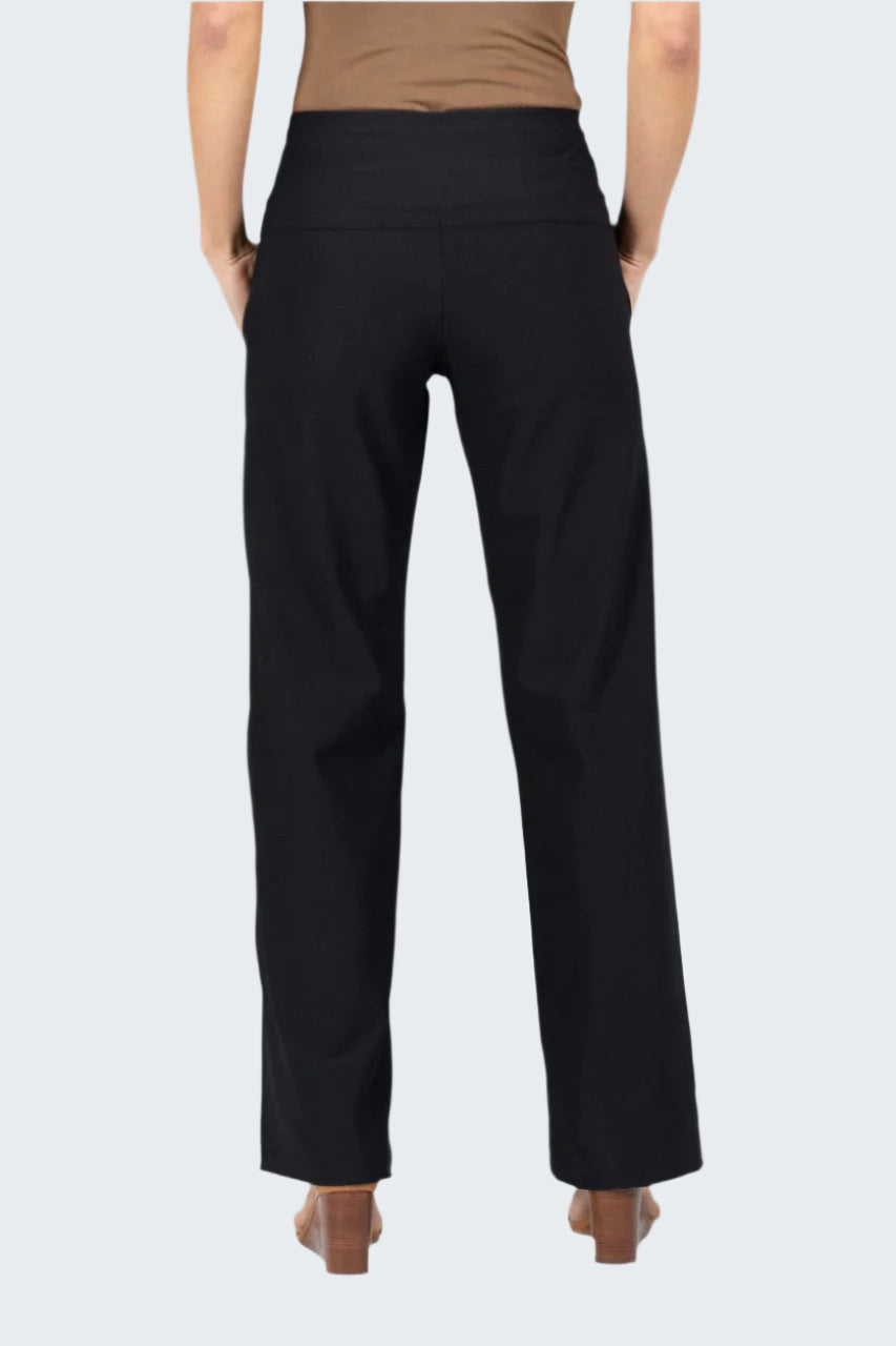 Black pants worn by a person on a gray background