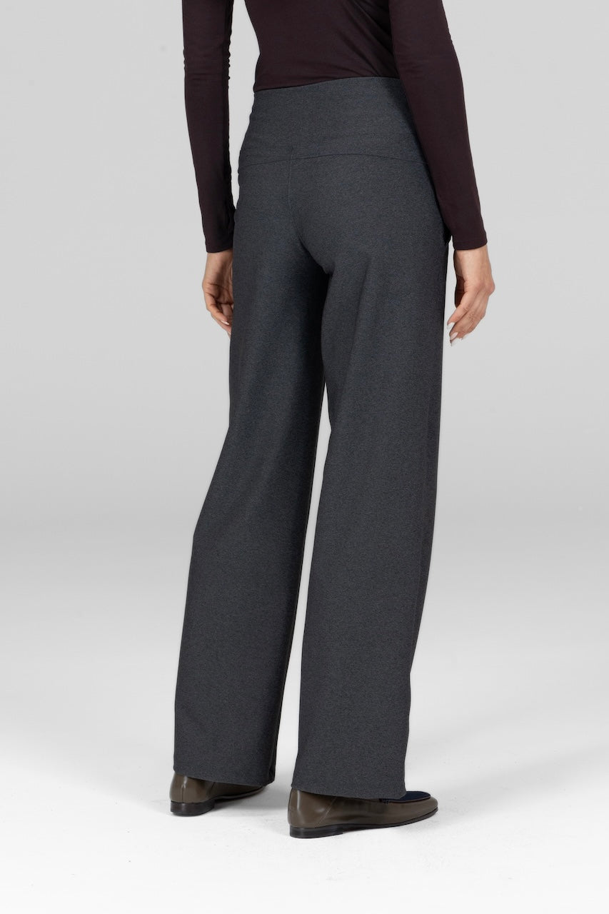 Person wearing gray pants on a white background