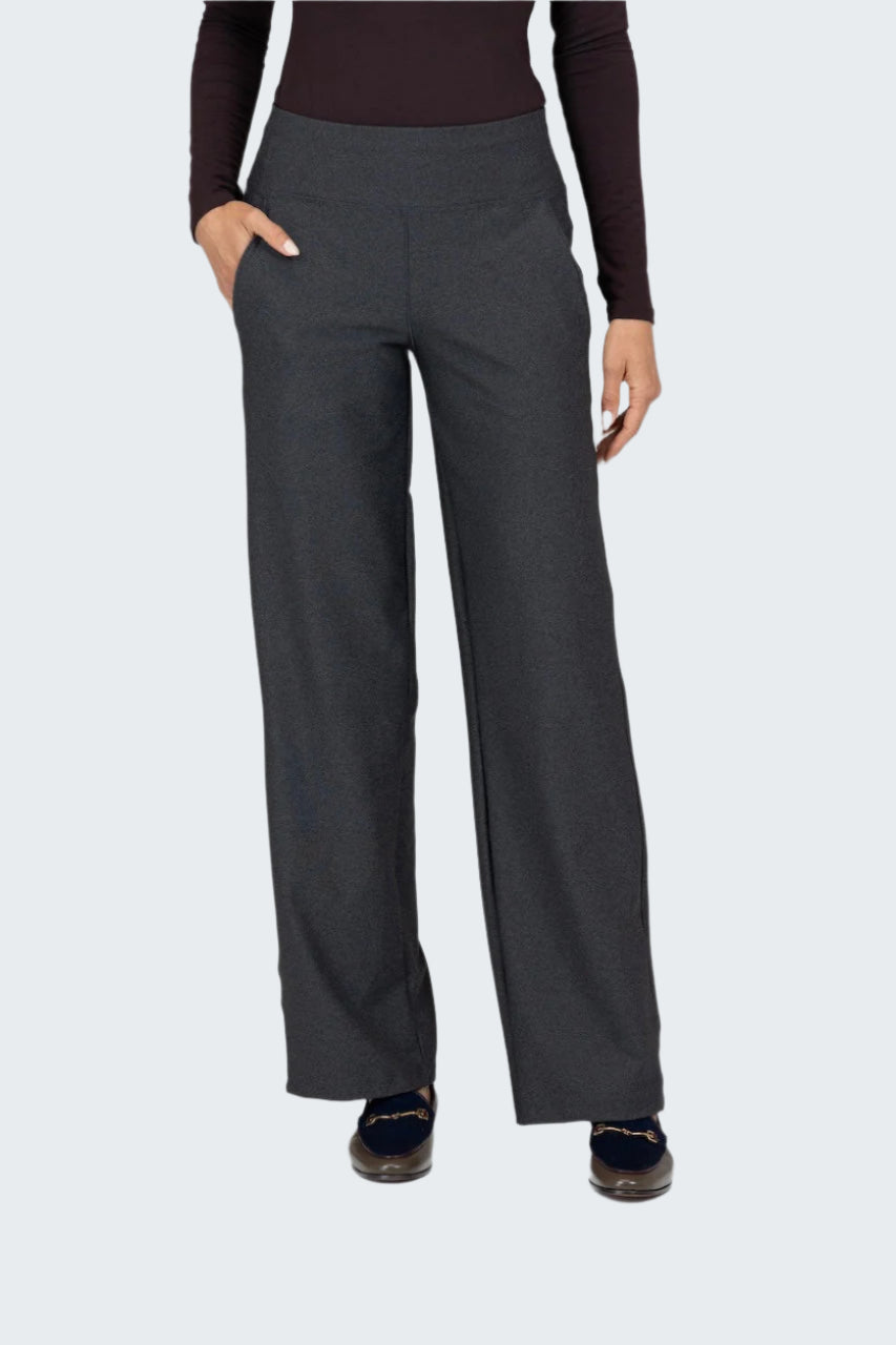 Person wearing dark gray pants on a white background