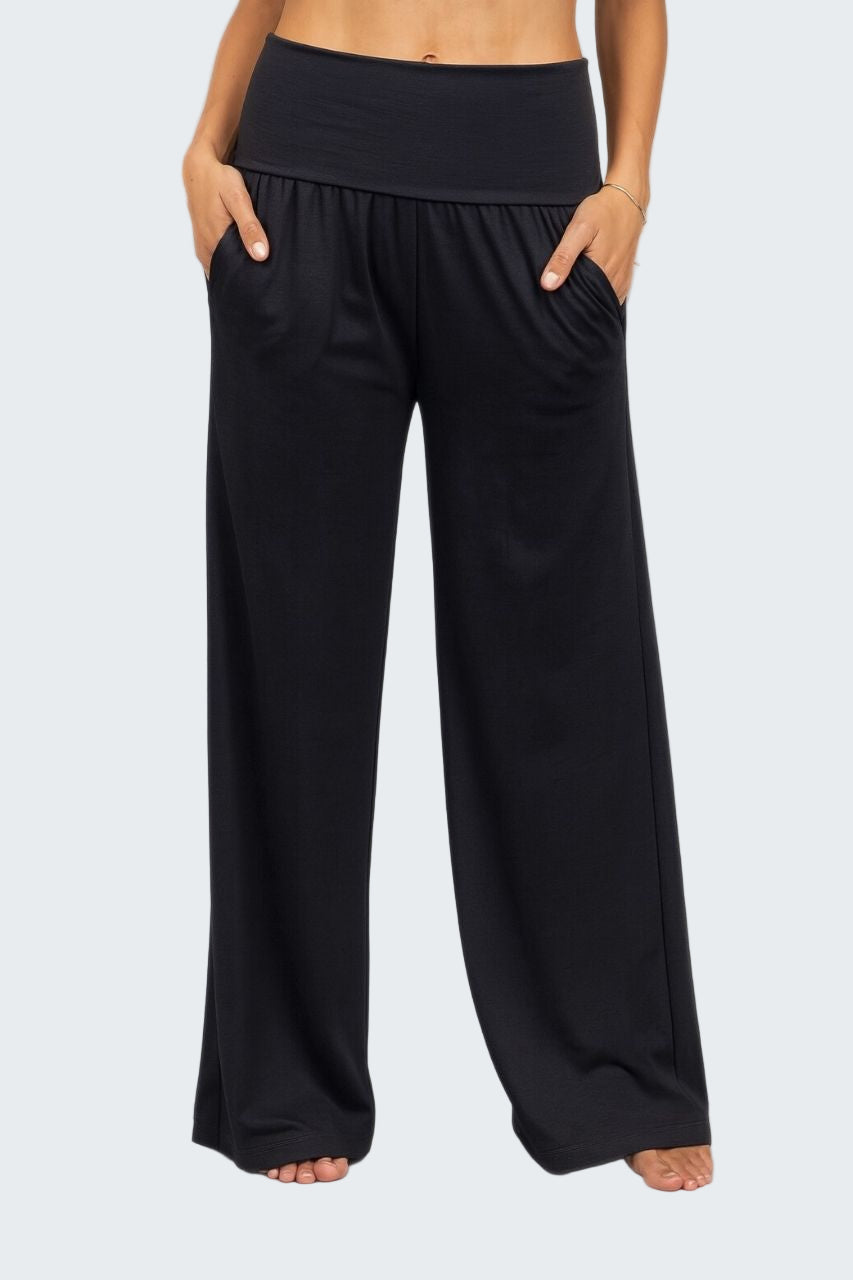 Black wide-leg pants worn by a person on a plain background
