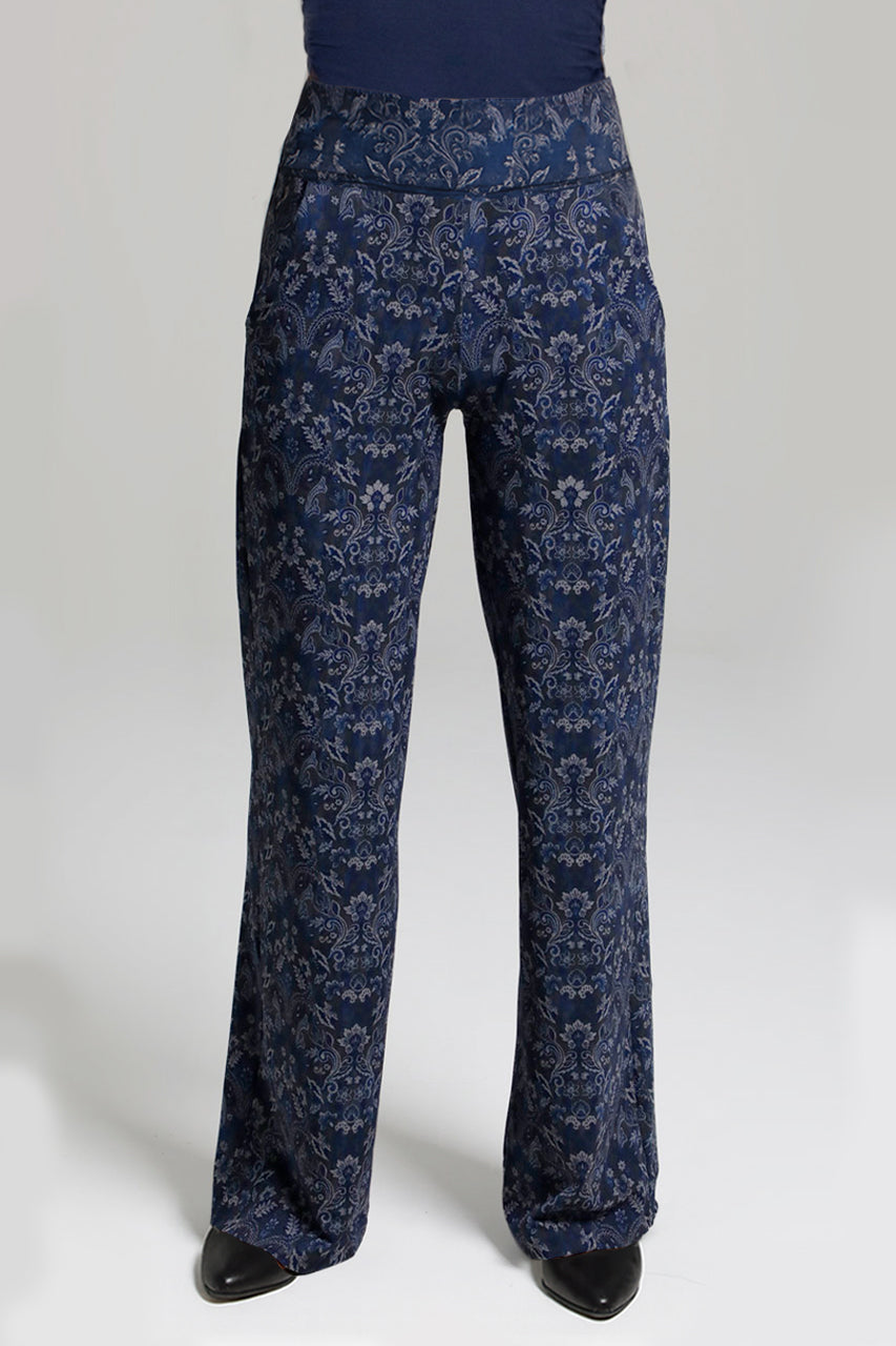 Navy blue floral-patterned pants on a white background