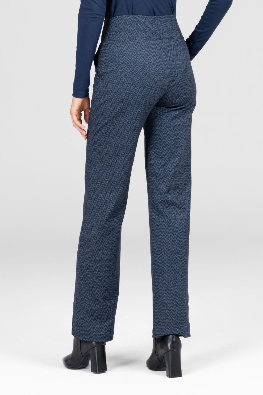 Blue pants worn by a person on a white background