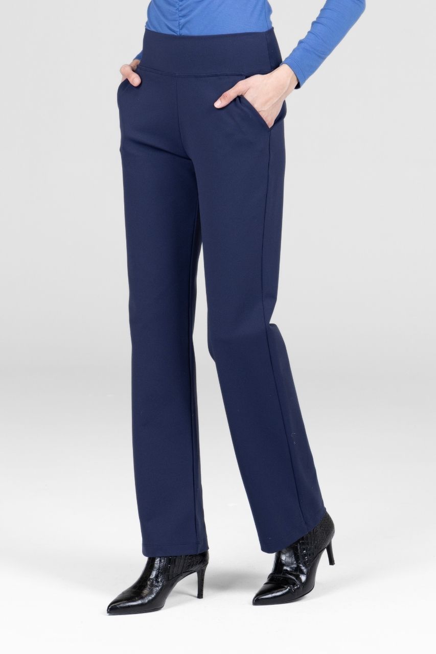 Navy blue pants worn by a person on a white background