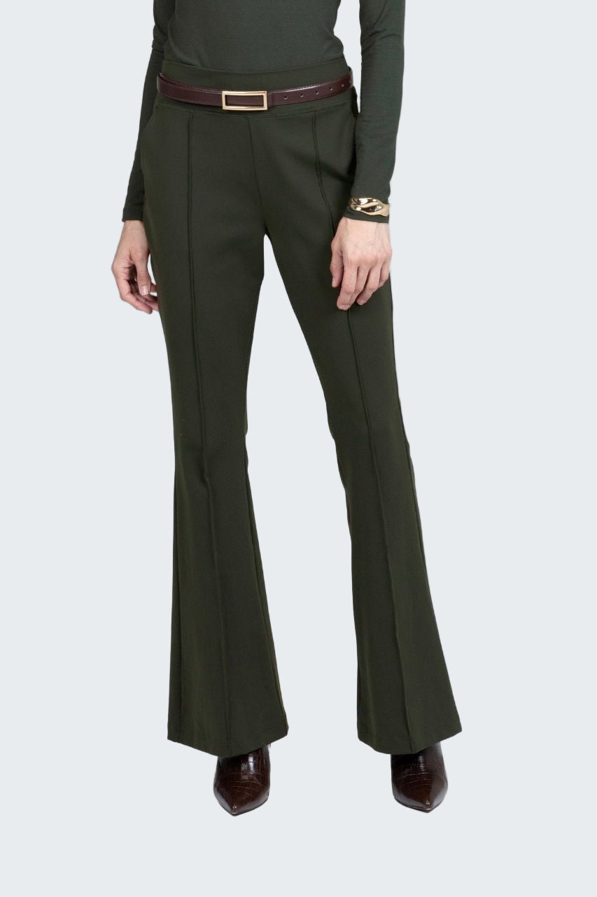 Green dress pants with a belt on a white background