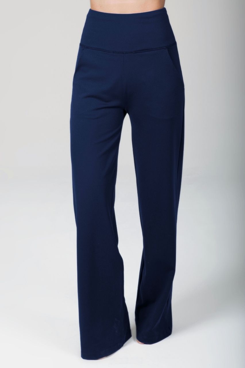 Navy blue flared pants on a white background
