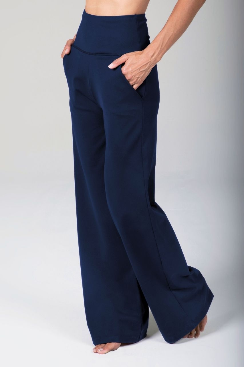 Navy blue wide-leg pants worn by a person on a white background