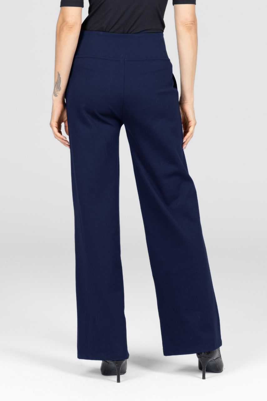 Navy blue pants worn by a person on a white background