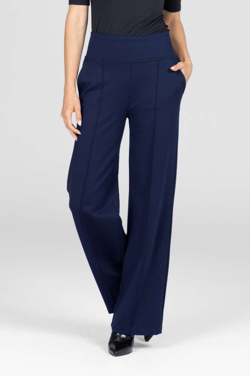 Navy blue wide-leg pants worn by a person on a white background