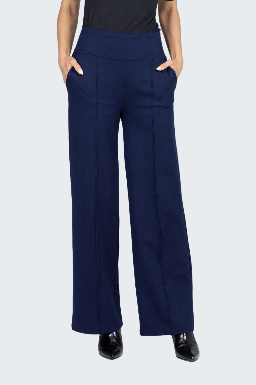 Navy blue wide-leg pants worn by a person on a white background