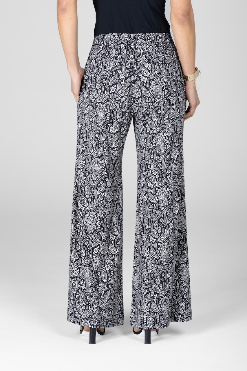 Patterned pants worn by a person on a white background