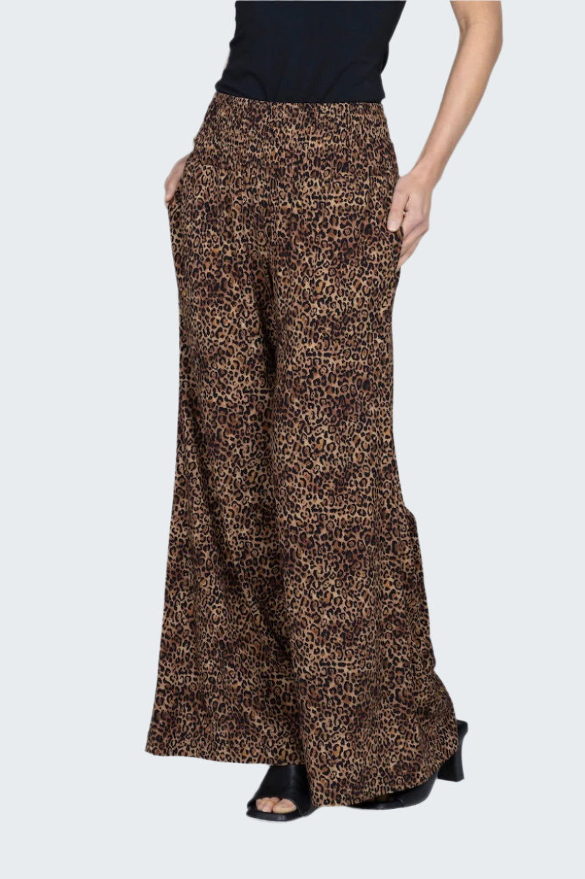 Leopard print wide-leg pants worn by a person on a white background