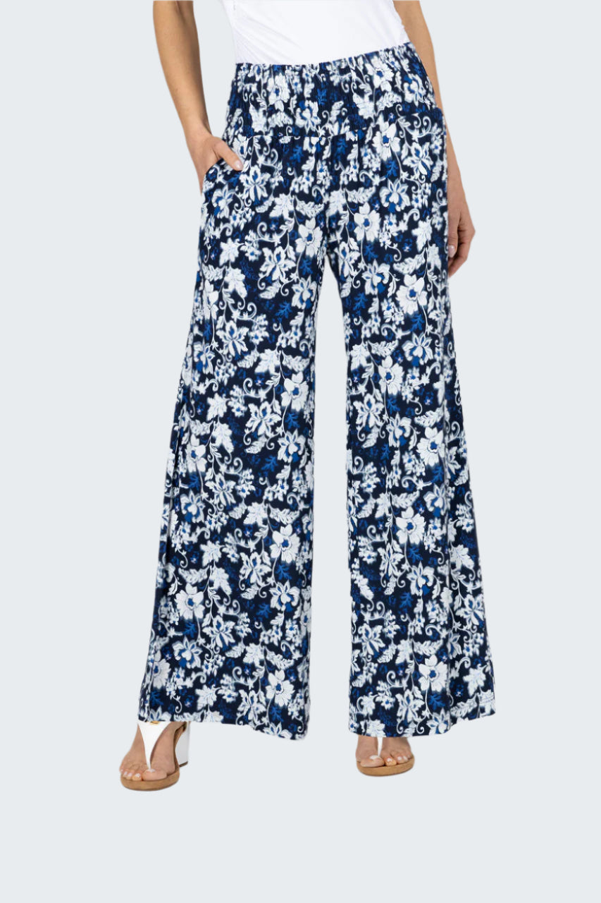 Navy and white floral wide-leg pants on a plain background