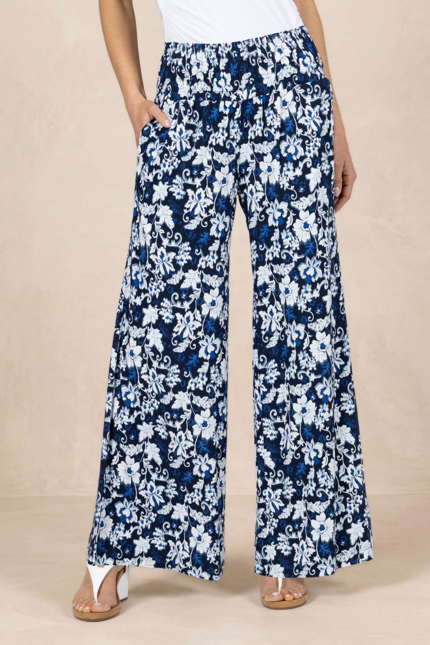 Navy and white floral wide-leg pants on a beige background