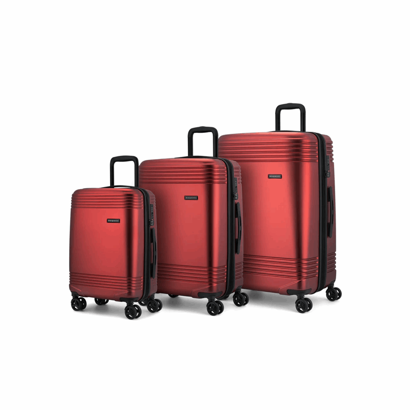 Set of three red suitcases of different sizes on a white background