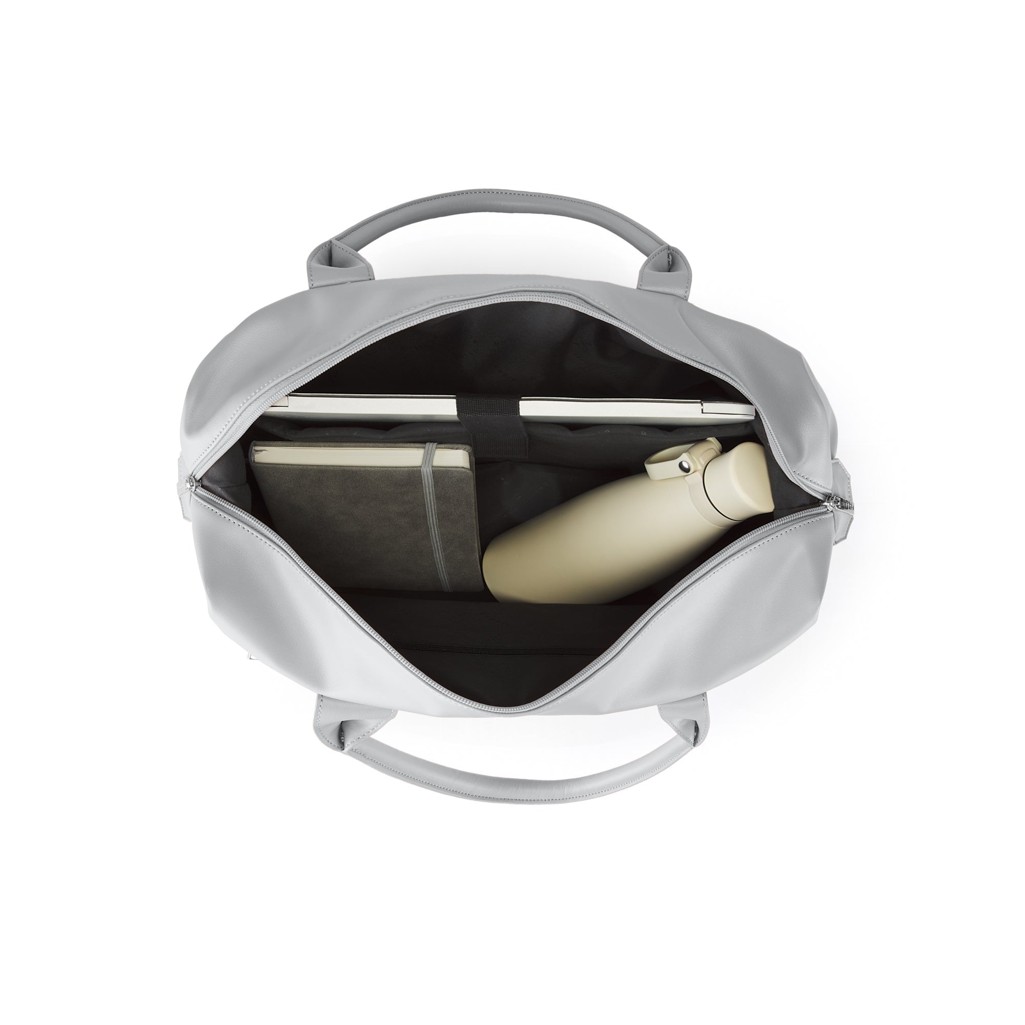 Silver backpack with a black interior, containing a notebook and a bottle, on a white background.