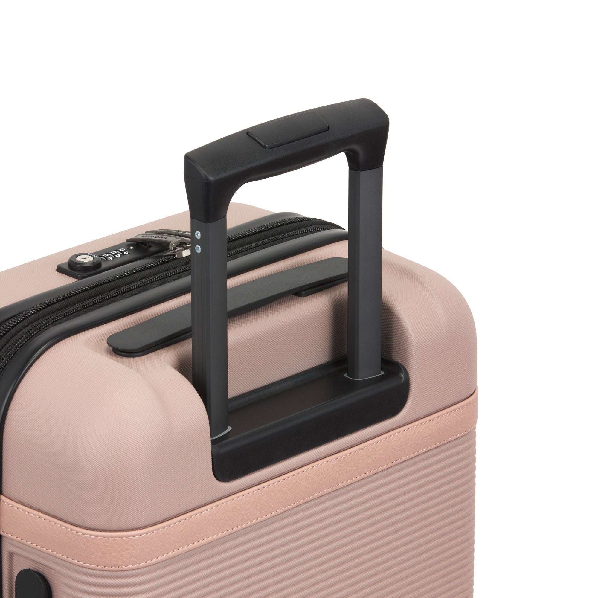 Close-up of a pink suitcase with a black handle on a white background