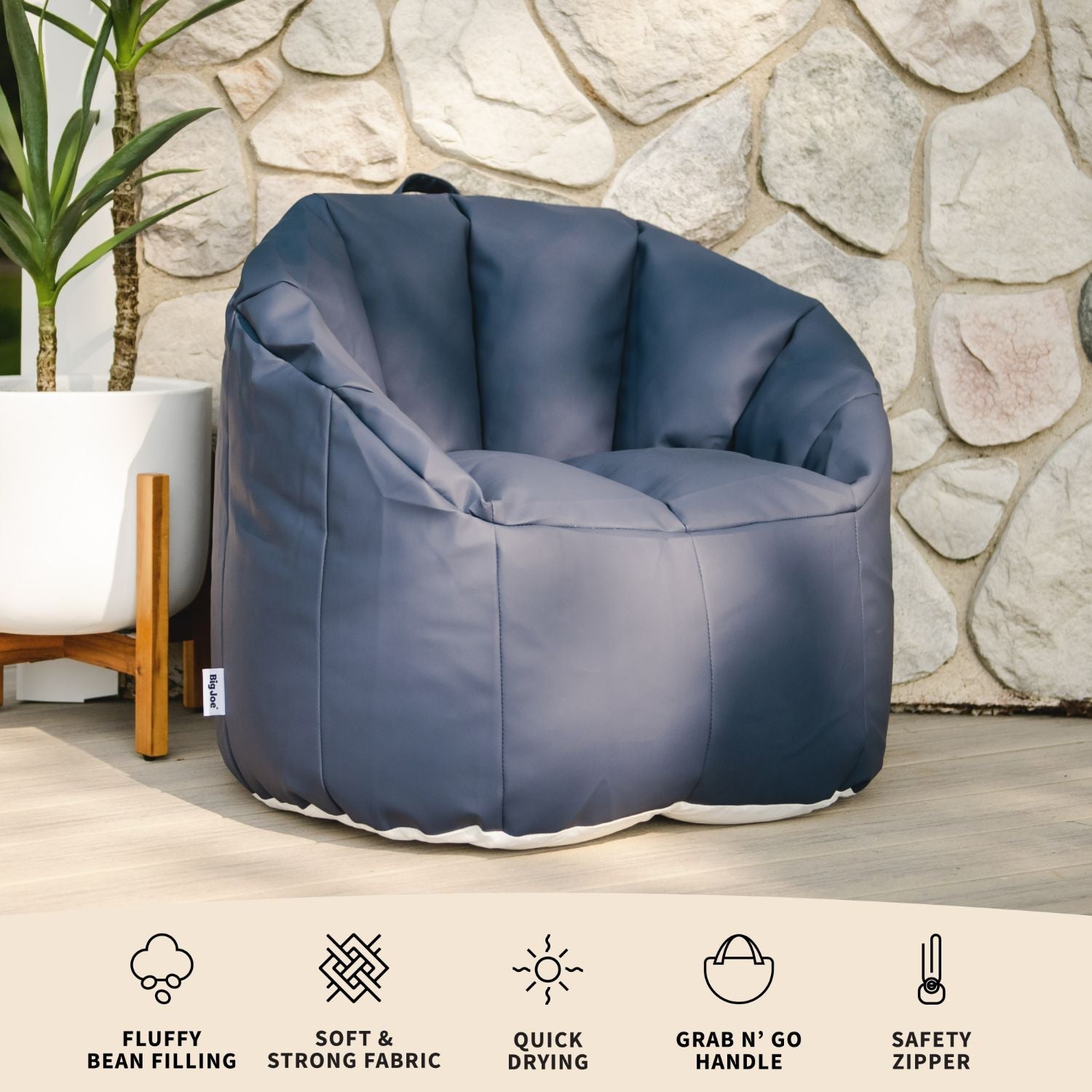 Blue inflatable chair with features listed below against a stone wall background