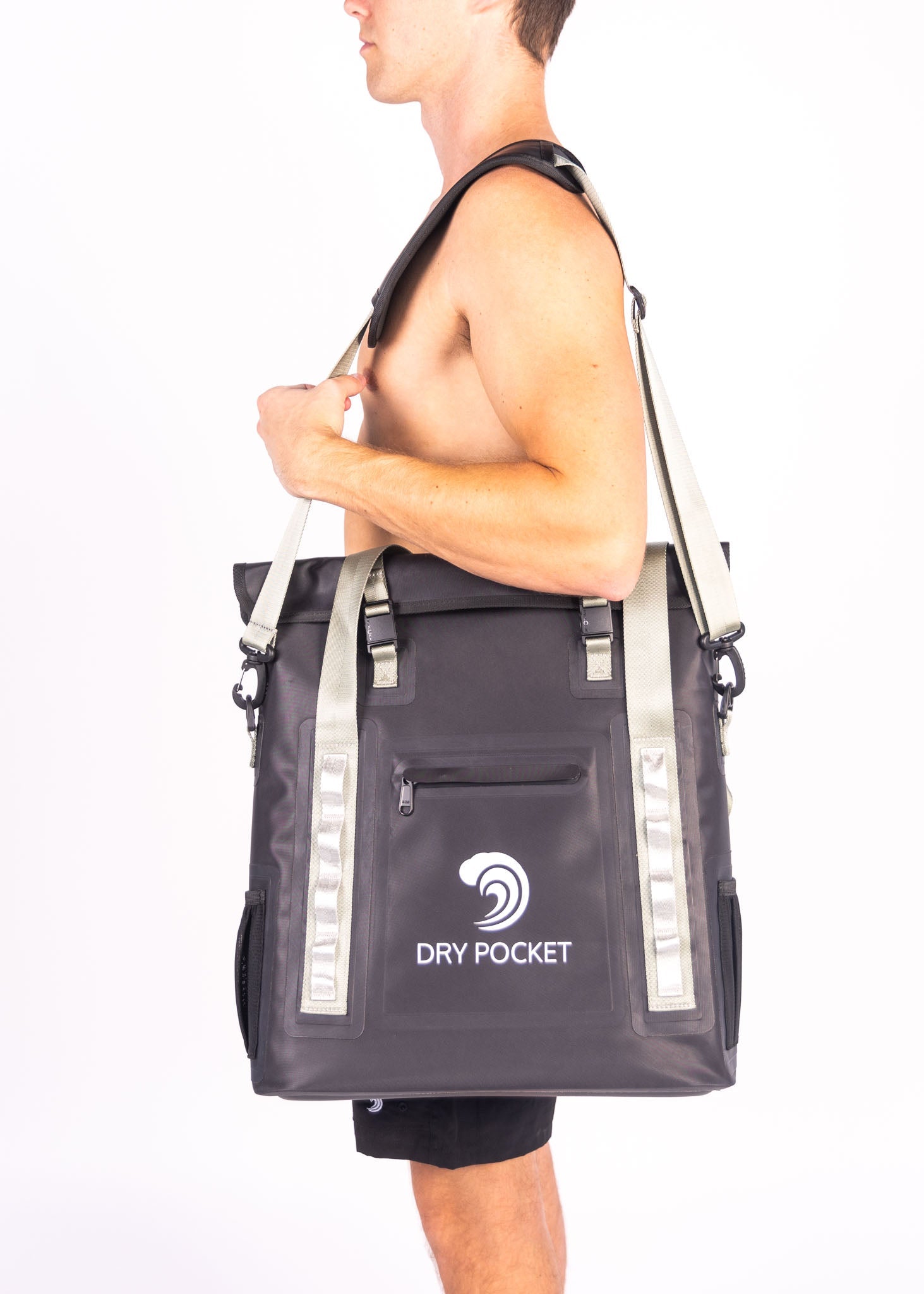 Person carrying a gray tote bag with 'Dry Pocket' logo on a white background