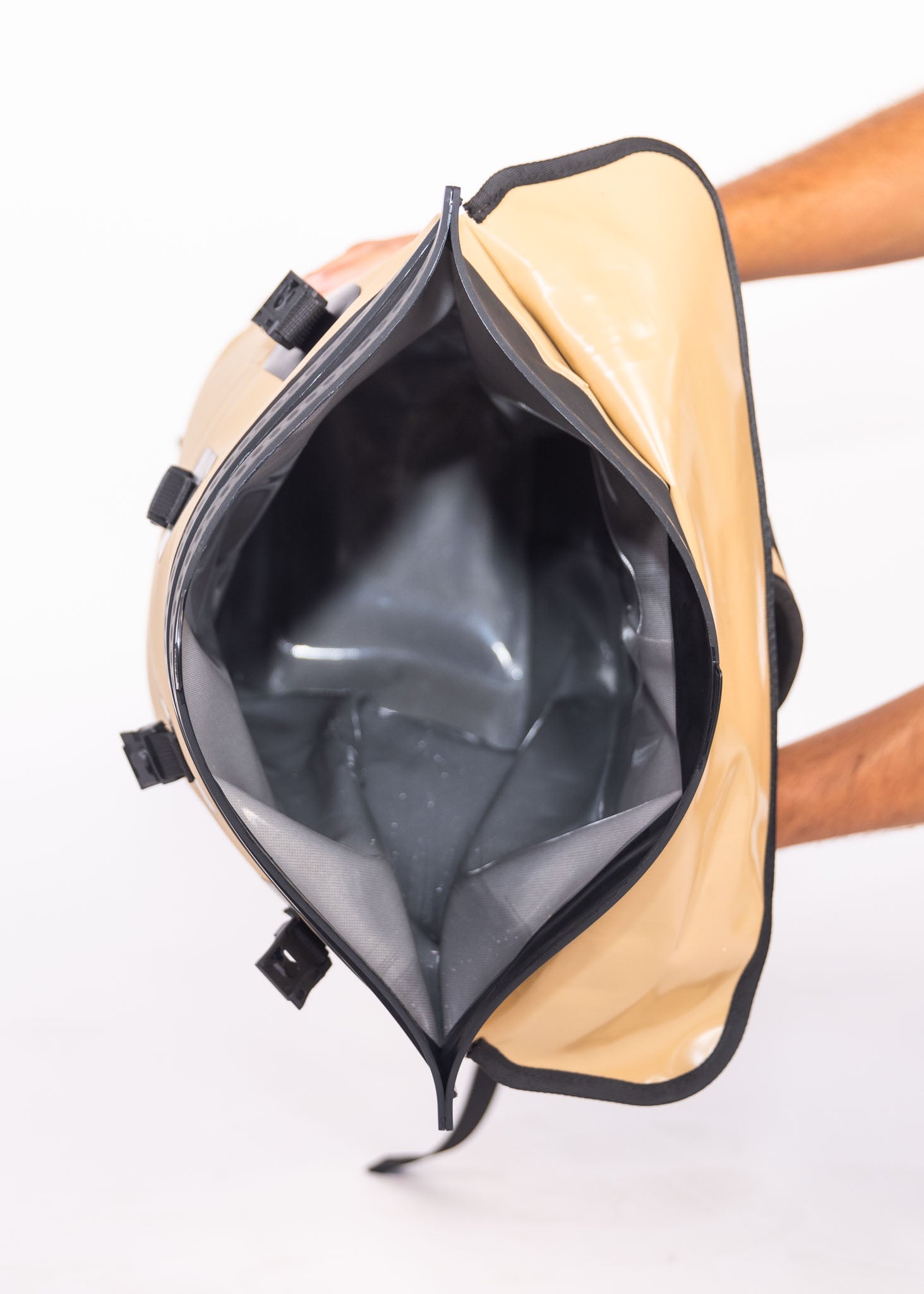 Beige backpack with a clear front panel on a white background