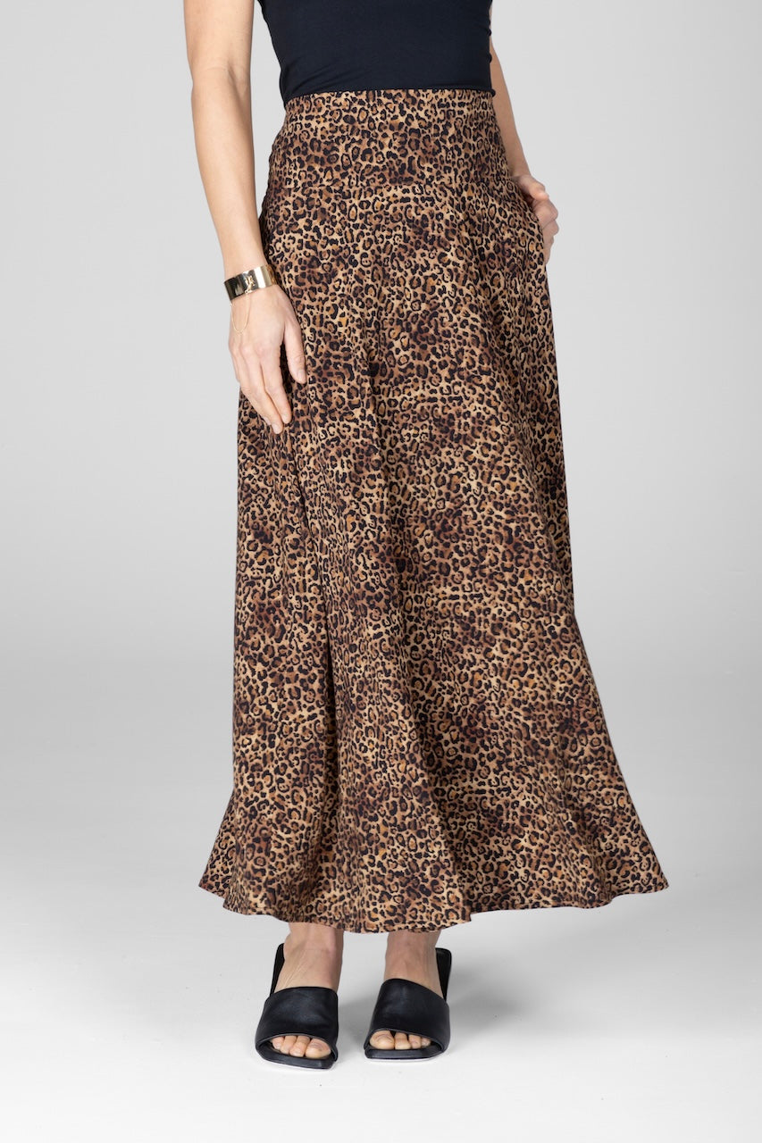 Leopard print skirt worn by a person on a white background