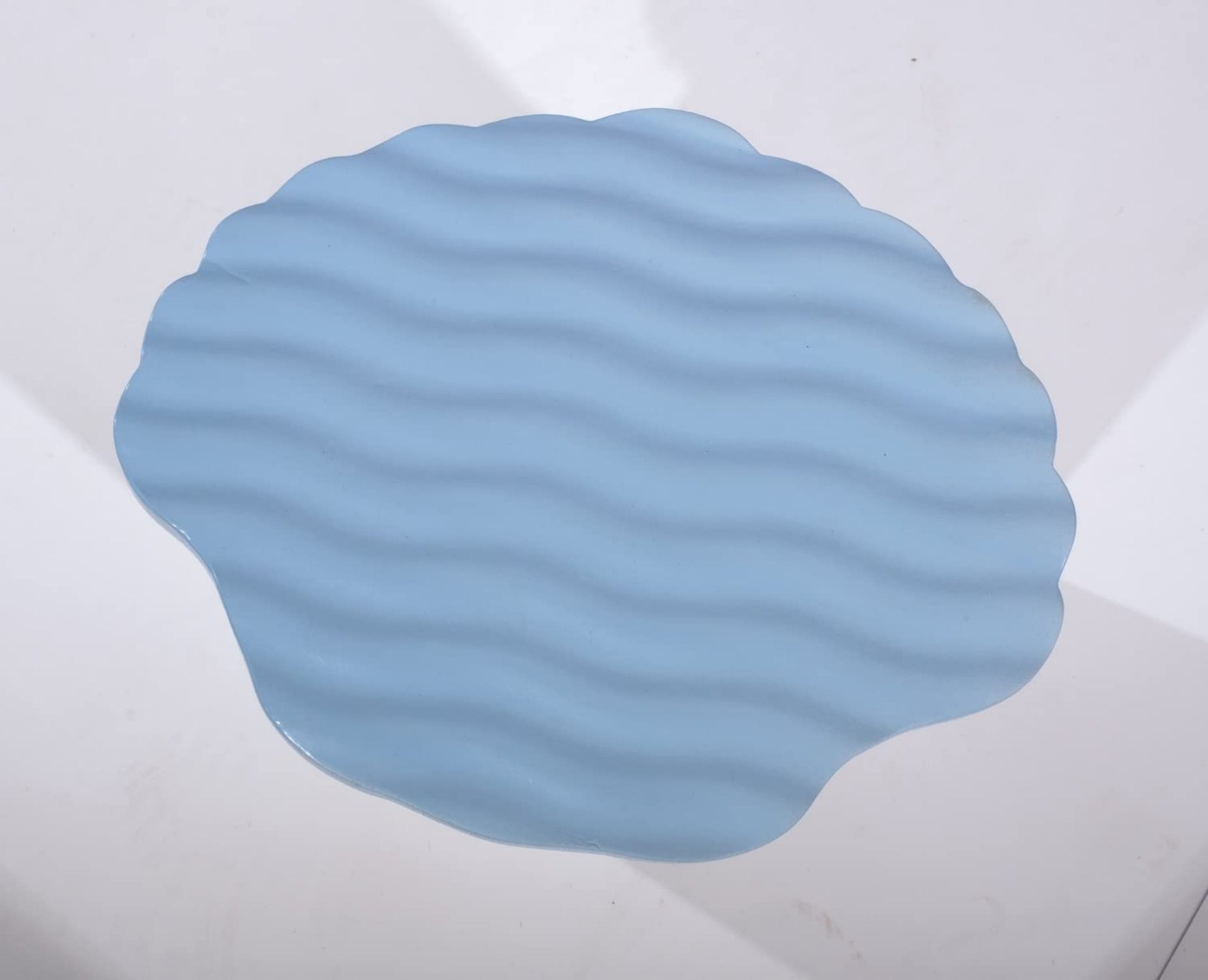 Blue textured cushion on a white background