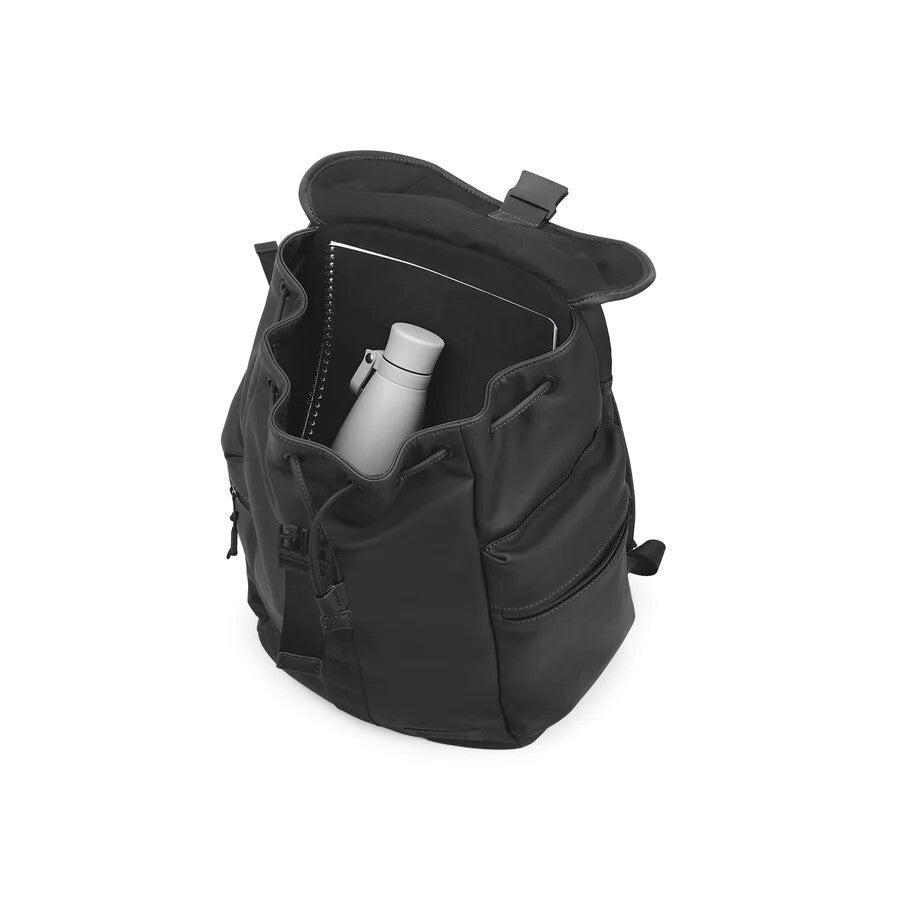 Black backpack with a water bottle inside on a white background