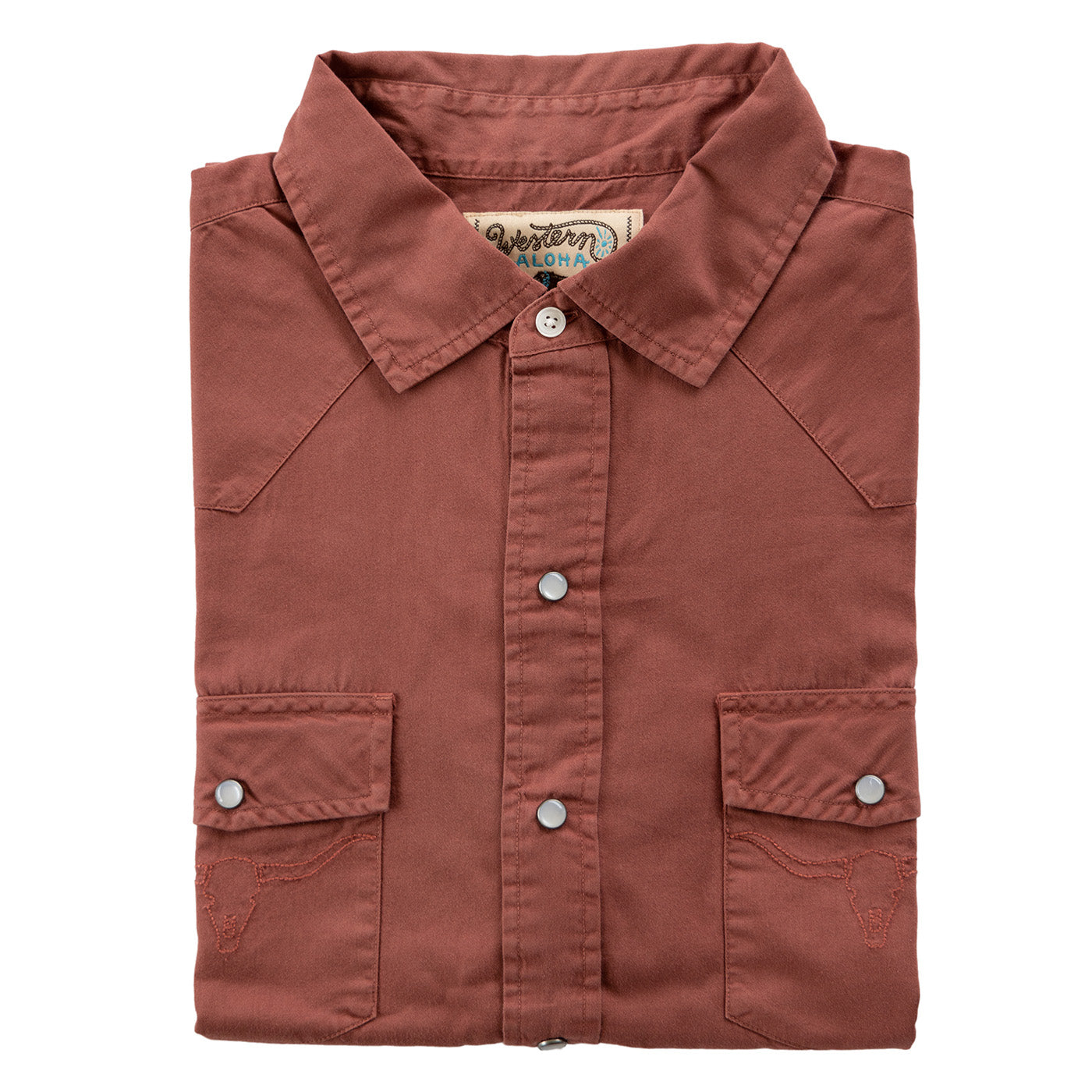 Folded brown shirt with button details on a white background