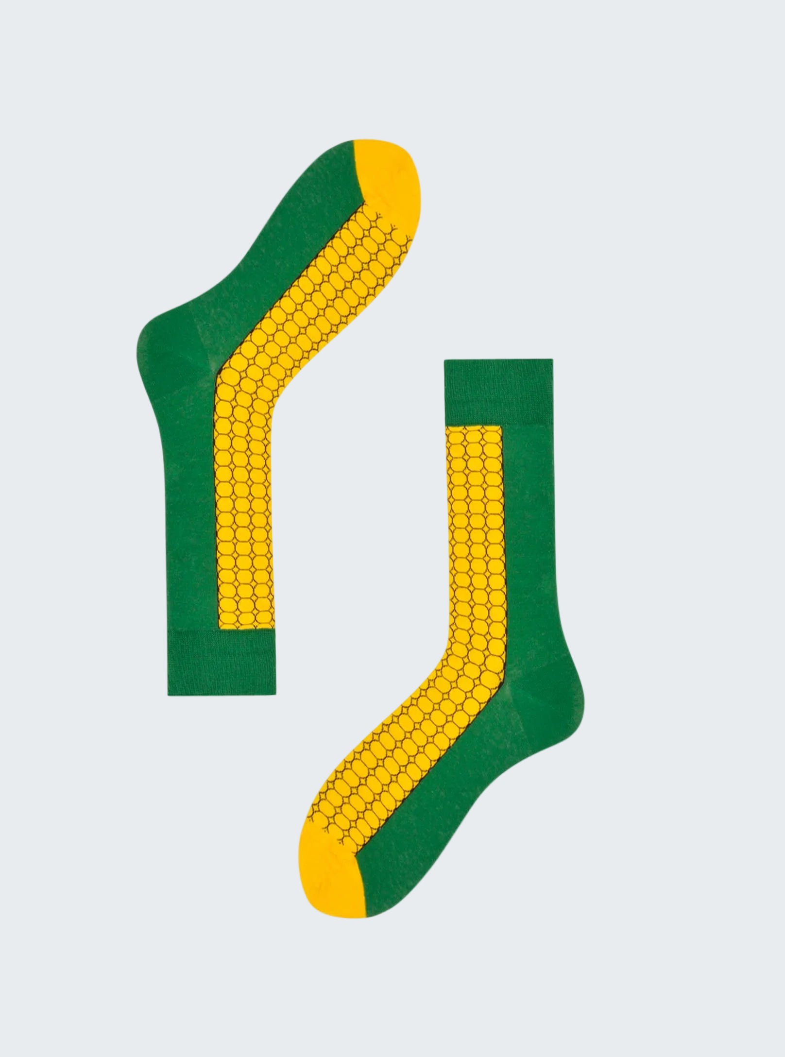 Green and yellow socks with corn design on a white background