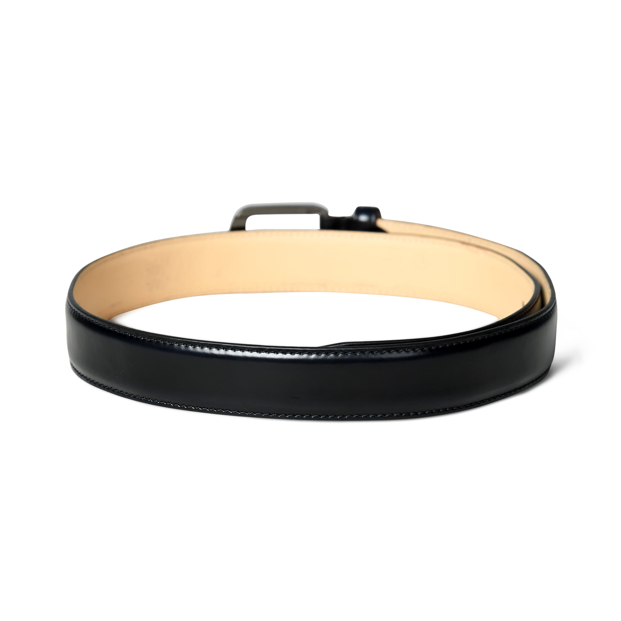 Black leather belt with a beige interior on a white background