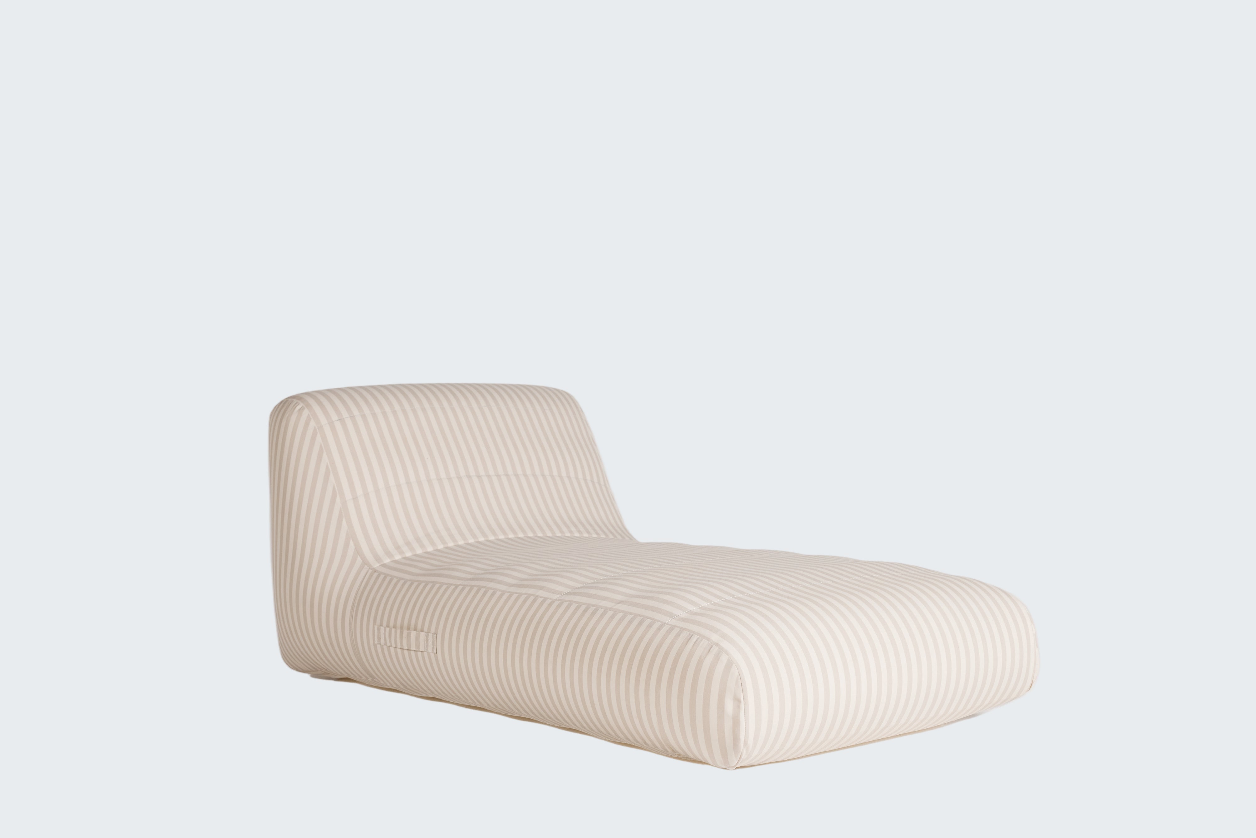 Beige lounge chair on a white background