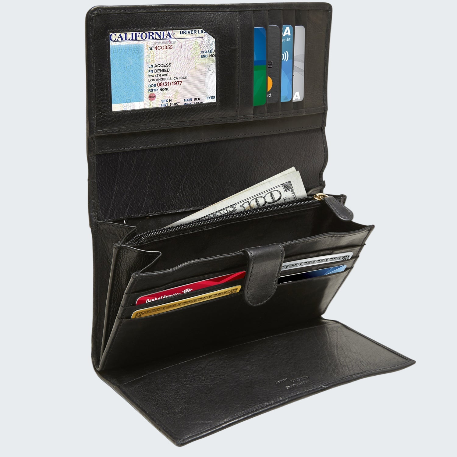 Black leather wallet with various cards and money on a white background
