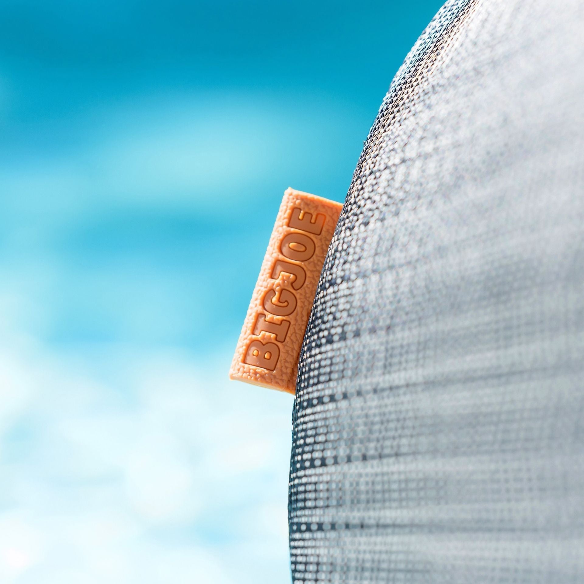 BIGJOE logo on a product with a blue sky background