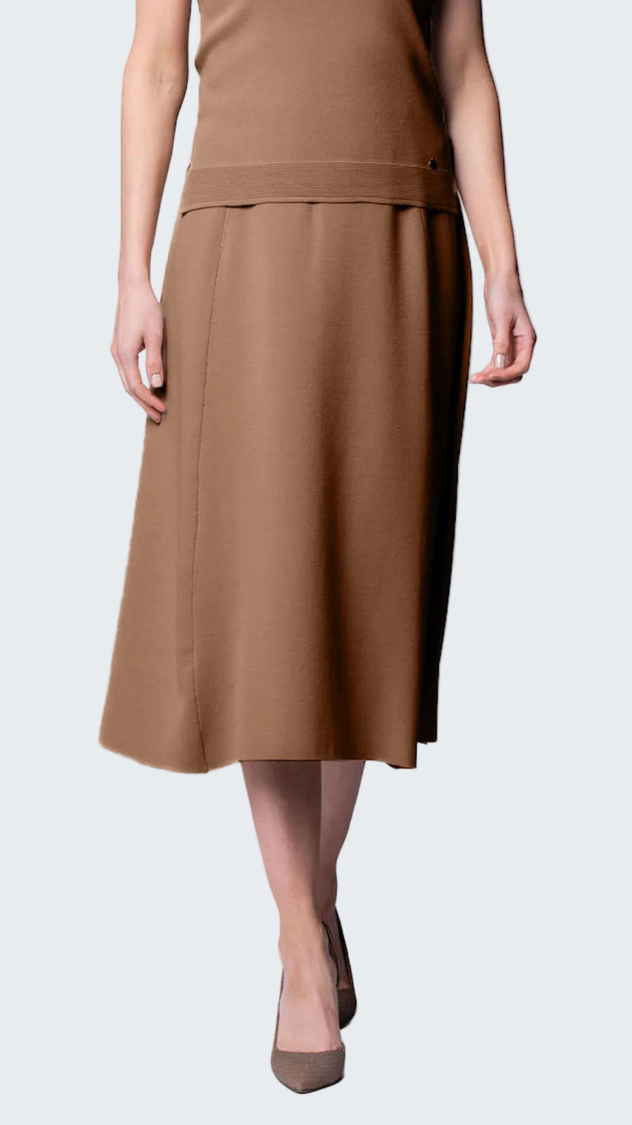 Woman wearing a brown dress on a white background