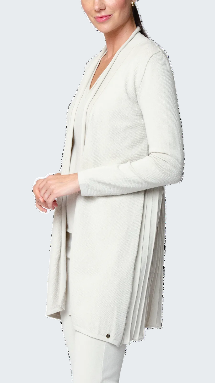 Woman wearing a white blazer with a long, flowing design on a white background
