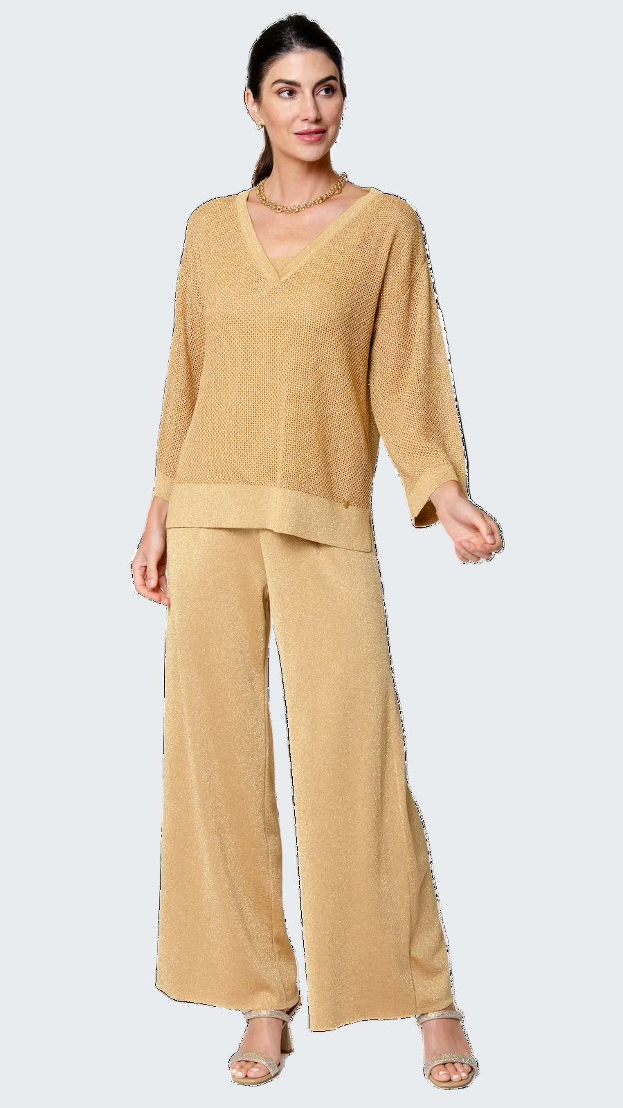 Woman wearing a beige outfit on a white background