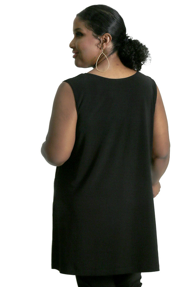 Person wearing a black sleeveless top on a white background