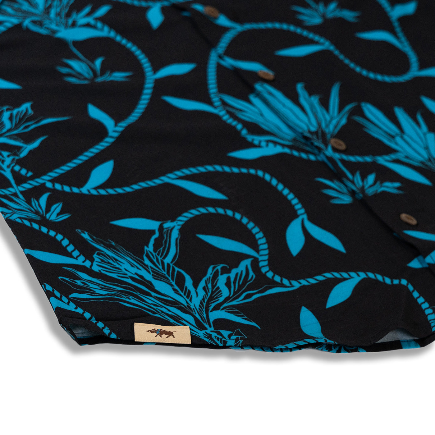 Black fabric with blue floral pattern and brand label
