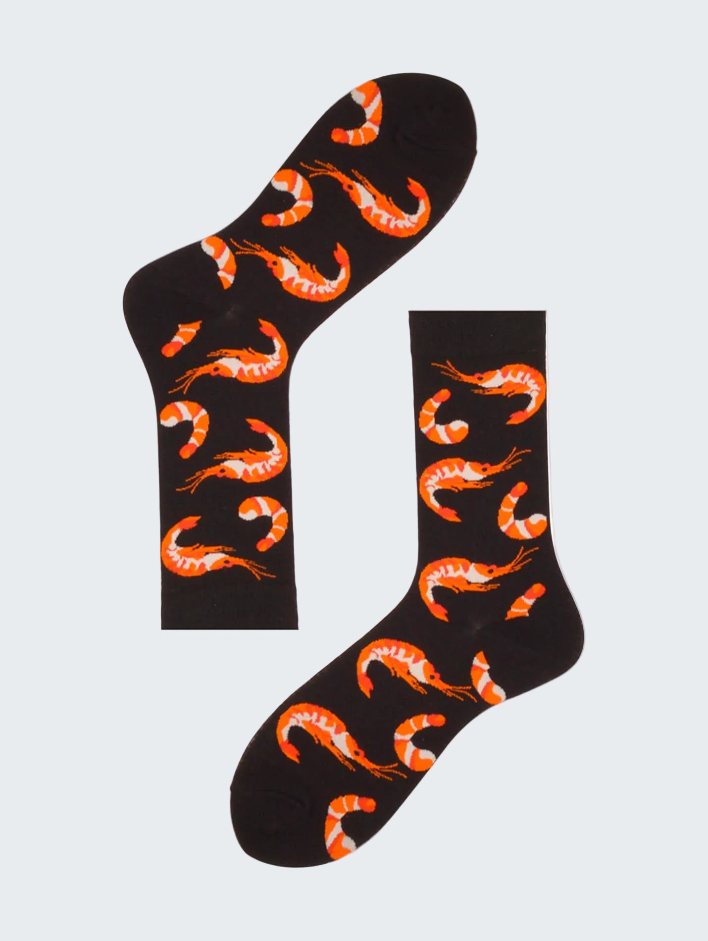 Black socks with orange shrimp pattern on a white background