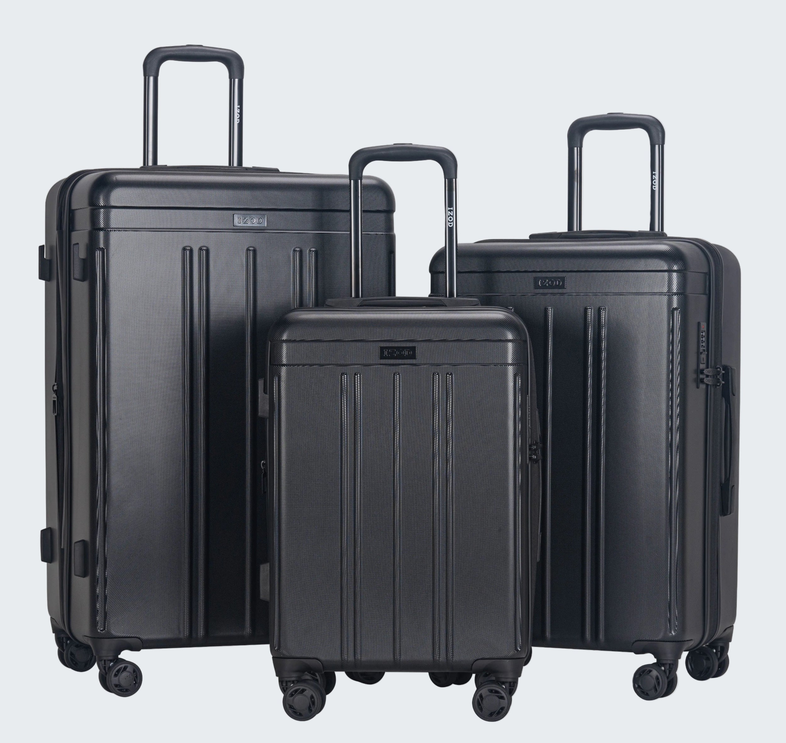 Set of three black suitcases of different sizes on a white background