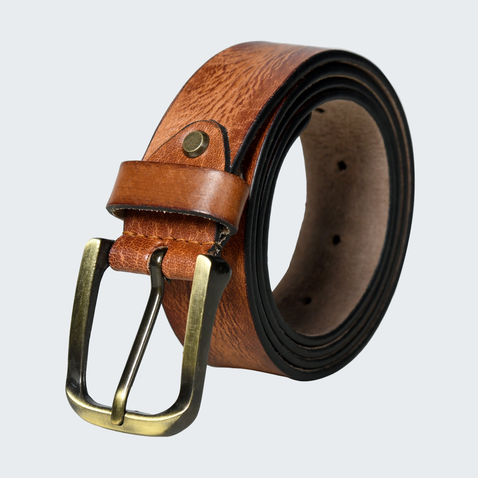 Brown leather belt with brass buckle on a white background