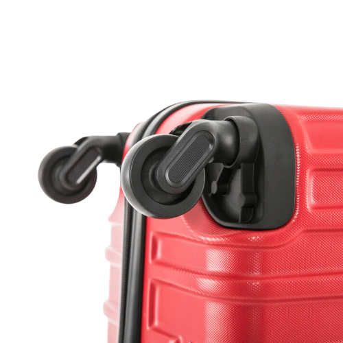 Close-up of a red suitcase handle on a white background