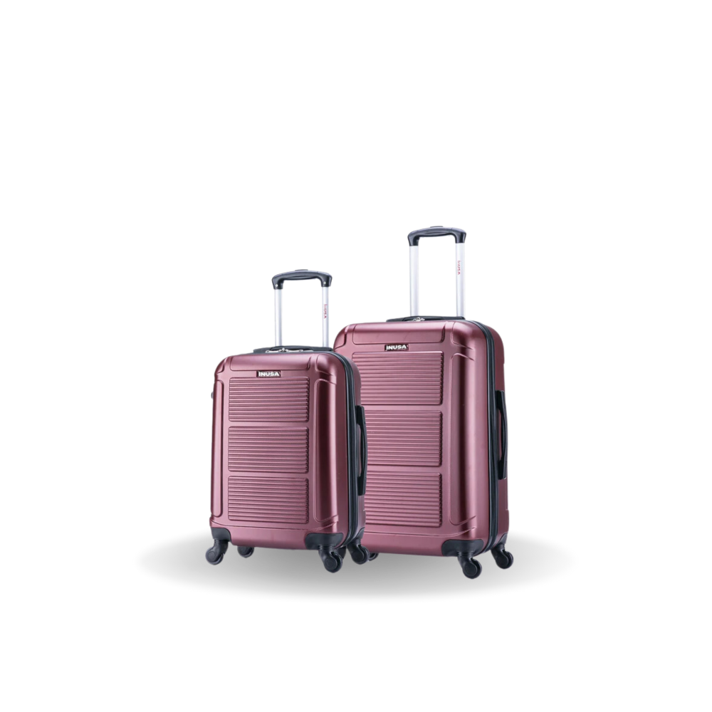 Two pink suitcases with wheels on a white background
