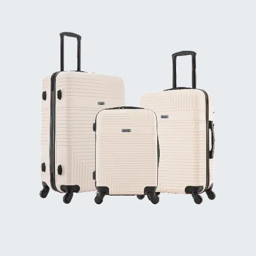 Set of three beige suitcases with black handles and wheels on a white background