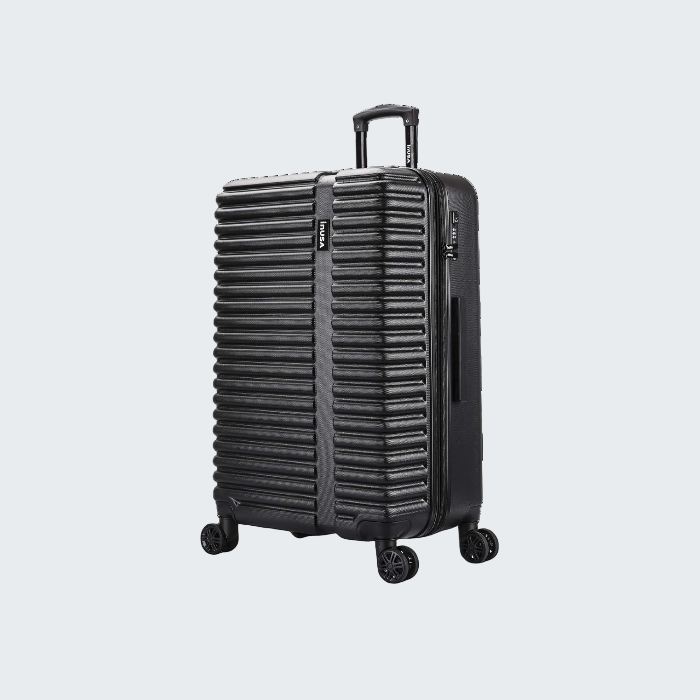Black suitcase with a textured surface on a white background