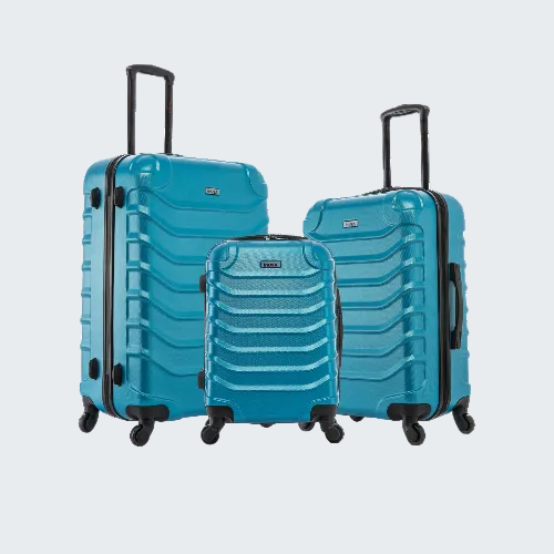 Set of three blue suitcases with black wheels on a white background