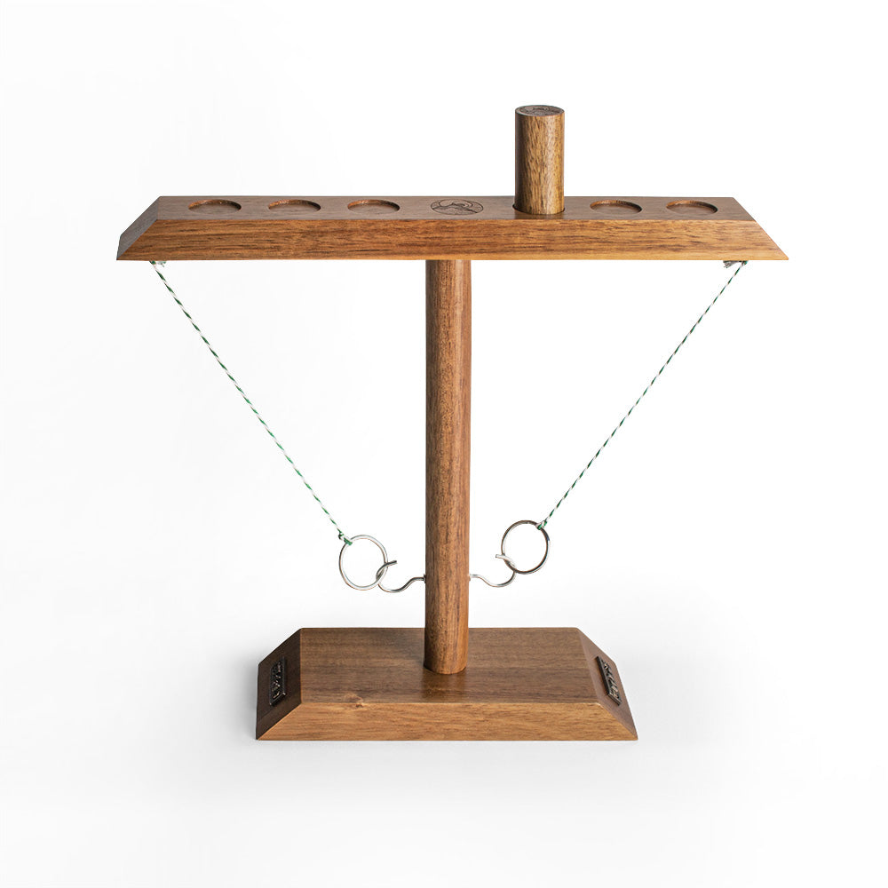 Wooden cat toy with hanging ball on a white background