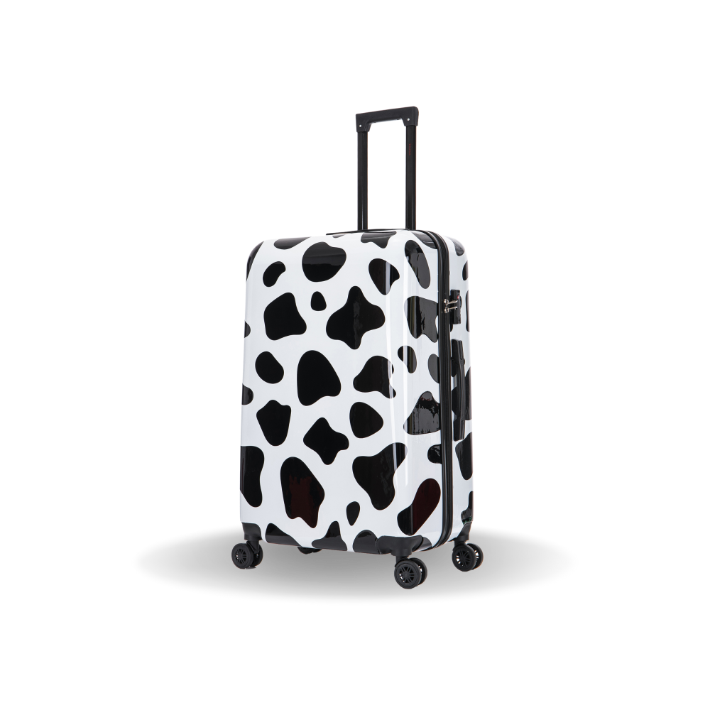 Black and white cow print suitcase on a white background