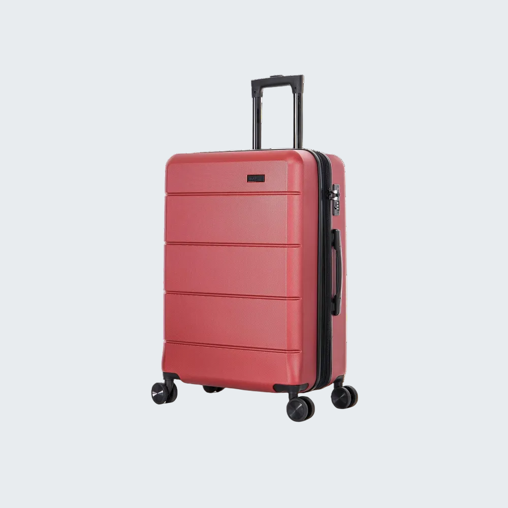 Red suitcase with black wheels on a white background